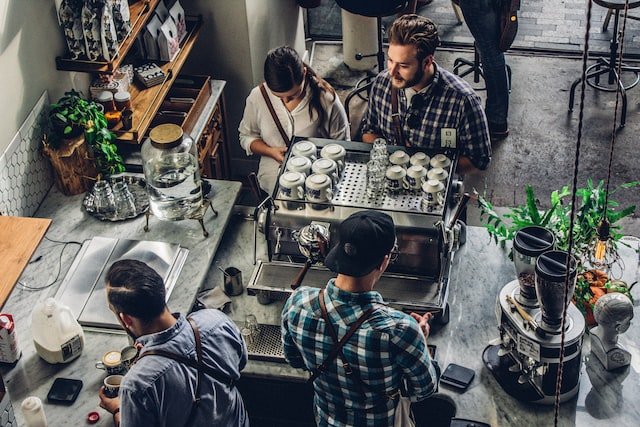 Customers waiting in line at a coffee shop