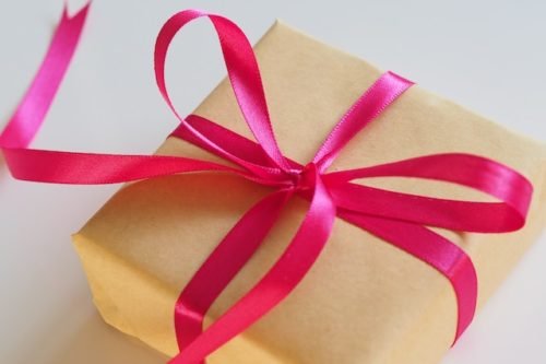 wrapped gift with a pink bow